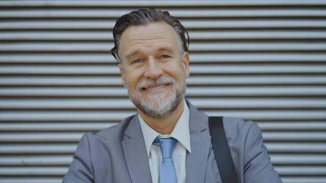 Video collection of different people of many ethnicities smiling and making expressions to camera.