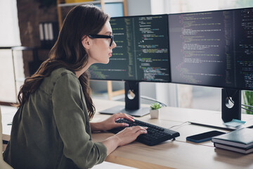 Photo of clever busy lady cyber safety expert wear glasses coding modern device indoors workstation workshop