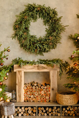 Christmas decorations.wooden fireplace decorated with wood and christmas lights