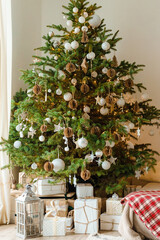 Christmas decorations.wooden fireplace decorated with wood and christmas lights