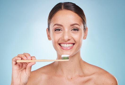 Brushing Teeth, Dental And Woman With Toothbrush For Teeth Whitening And Beauty, Oral Health And Fresh Breath With Studio Background. Mouth Wellness, Invisalign Portrait And Clean With Bamboo Brush.