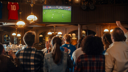 Soccer Club Members Cheering for Their Team, Playing in an International Cup Final. Supportive Fans Standing in a Bar, Cheering, Raising Hands and Shouting. Friends Celebrate Victory After the Goal.