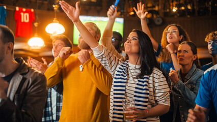 Group of Soccer Fans with Colored Faces Watching a Live Football Match in a Sports Bar. People Cheering for Their Team. Player Scores a Goal and Crowd Celebrate Winning the Championship.