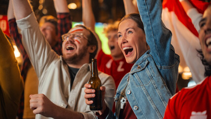 Group of Multicultural Friends Watching a Live Soccer Match in a Sports Bar. Focus on Beautiful Female. Young People Celebrating When Team Scores a Goal and Wins the Football World Cup.