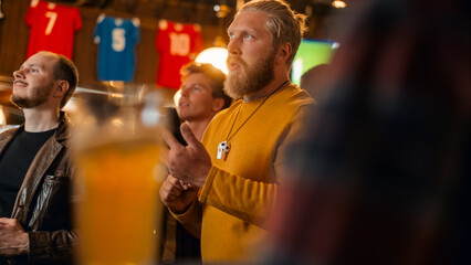 Excited Masculine Man Holding a Smartphone, Feeling Nervous About the Sports Bet He Put on a Favorite Soccer Team. Ecstatic When Football Team Scores a Goal and He Wins a High Stakes Casino Prize.