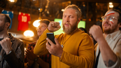 Excited Masculine Man Holding a Smartphone, Feeling Nervous About the Sports Bet He Put on a Favorite Soccer Team. Ecstatic When Football Team Scores a Goal and He Wins a High Stakes Casino Prize.