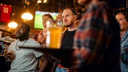 Portrait of a Serious Young Man Holding a Smartphone, Anxious About the Sports Bet on a Soccer Match. Looking Like an English Pub Regular, Wearing a Stylish Leather Jacket. Emotional After Winning.