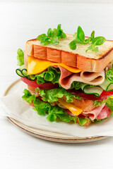 Club sandwich, on a white table, close-up, no people, horizontal, homemade,