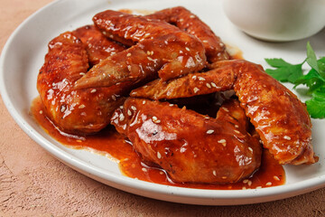 Chicken wings, with barbecue sauce, with tomato sauce, fast food, no people,