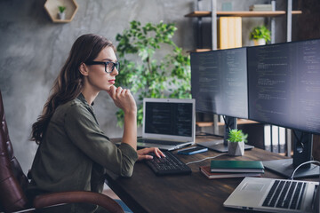 Profile side photo of smart focused minded lady solve work issue hacking sites upgrade program...