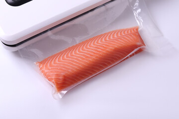 Salmon fillets in a vacuum package. Sous-vide, new technology cuisine. Selective focus, copy space