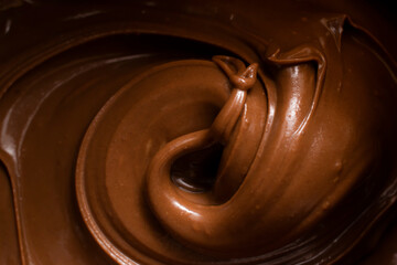 melted chocolate pouring and stirring