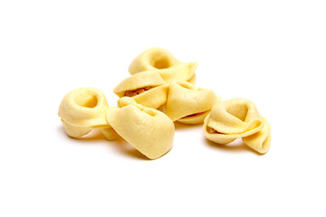 Tortellini stuffed pasta isolated on white background, closeup. Tortellini with raw prosciutto. Italian food