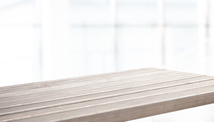 empty wooden table on background of abstract blur white interior, montage, product display, inside and window.