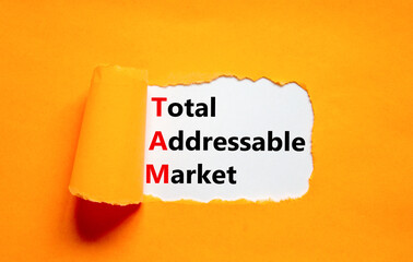 TAM total addressable market symbol. Concept words TAM total addressable market on white paper on a...