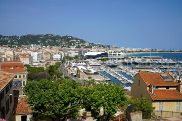Fototapeta na wymiar Cannes cityscape with port and yachts moored, France