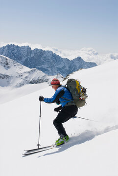 A man skis the Glacier du Mont Durand while touring the classic Haute Route in Switzerland.