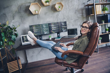 Photo of smiling cheerful lady freelancer wear glasses creating new start up modern gadget indoors...