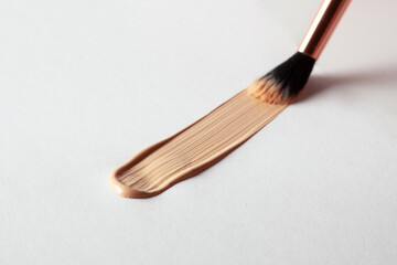 Make up smear foundation smudge drawing by cosmetic brush texture. Liquid foundation swatch close...