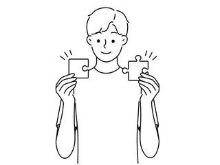 Smiling man connect jigsaw puzzles 