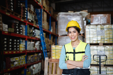 Fototapeta na wymiar Portrait of a Happy warehouse worker in a warehouse or storehouse while looking at camera.