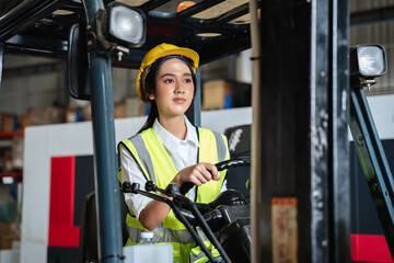 A warehouse worker forklift operator moves packages around with a manufacturing facility.
