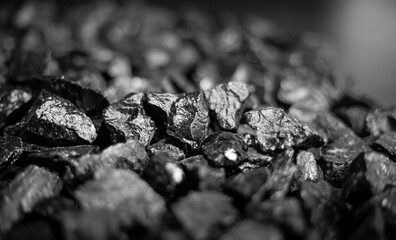 A heap of black natural coal, photo of coal mine background, texture	