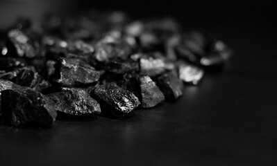 A heap of black natural coal, photo of coal mine background, texture	