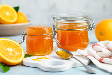 Orange jam in glass jars. Healthy delicious dessert. Selective focus