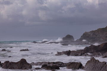 Storm waves crashing onto Cornish Rocks Dollar Cove, The Lizard, Cornwall