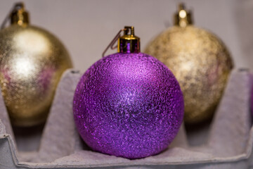 Christmas tree glitter balls in egg carton box. Easter and New Year concept