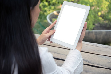 Woman using tablet blank screen mockup for design spec