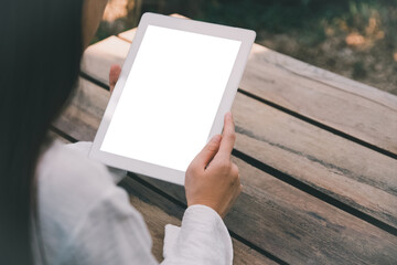 Woman using tablet blank screen mockup for design spec