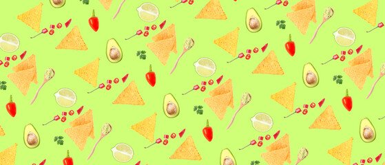Tasty nachos with avocados, chili peppers, lime, cilantro and guacamole sauce on green background