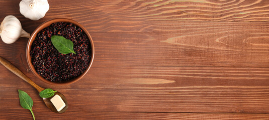 Composition with tasty quinoa on wooden background with space for text, top view