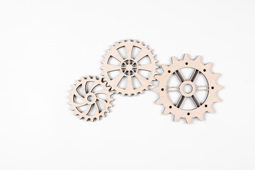 Gears. Gear wheel. Mechanisms are interconnected by themselves. On a white background. The concept of dependence on each other.
