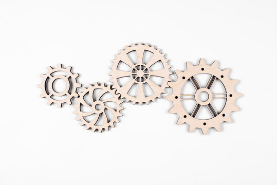 Gears. Gear wheel. Mechanisms are interconnected by themselves. On a white background. The concept of dependence on each other.