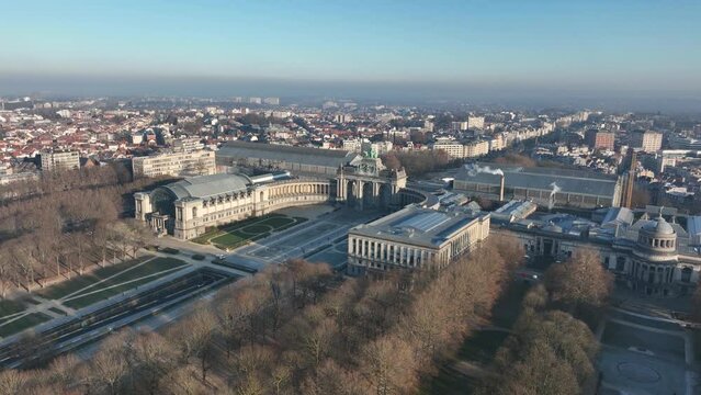 Jubel park, Monument du Cinquantenaire, Brussels, Belgium, touristic attraction, monument, city park. WInter, golden hour. Aerial drone overhead view.