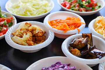 Plates with tasty food on black table, closeup