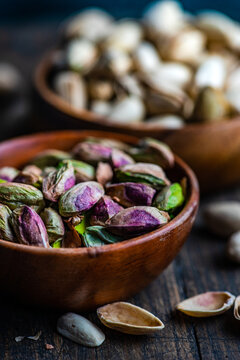 Raw organic pistachio nuts in the bowl
