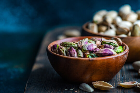 Raw organic pistachio nuts in the bowl