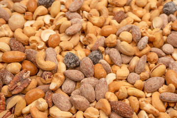 A group of almonds, pistachios, walnuts, macadamia, cashews.