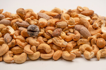A group of almonds, pistachios, walnuts, macadamia, cashews.