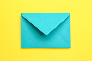 Paper envelope on yellow background