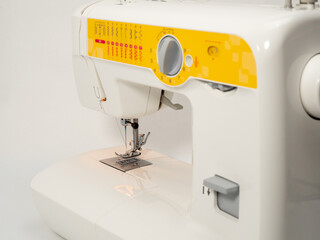 Electric sewing machine on a white background.