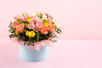 Bouquet of pink, yellow roses and purple flowers alstroemeria on a pink background. Birthday greeting card, Valentine's Day, Mother's Day