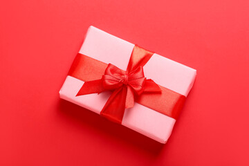 Gift for Valentine's Day celebration on red background