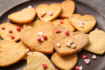 Obraz na płótnie Canvas Plate with tasty heart shaped cookies, closeup. Valentines Day celebration