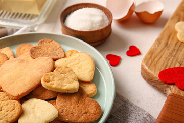 Plate with sweet heart shaped cookies on table, closeup. Valentines Day celebration