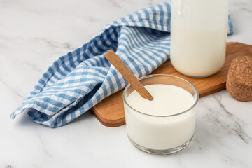 milk yogurt in a glass jars with spoons, Calcium rich diary product